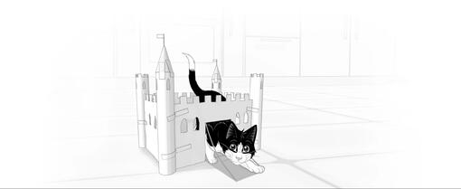 Kočka se plazí z papírového zámku