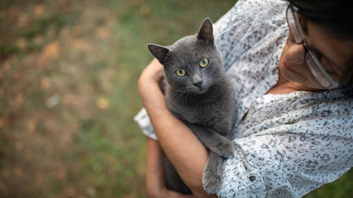Woman holding cat in her arms